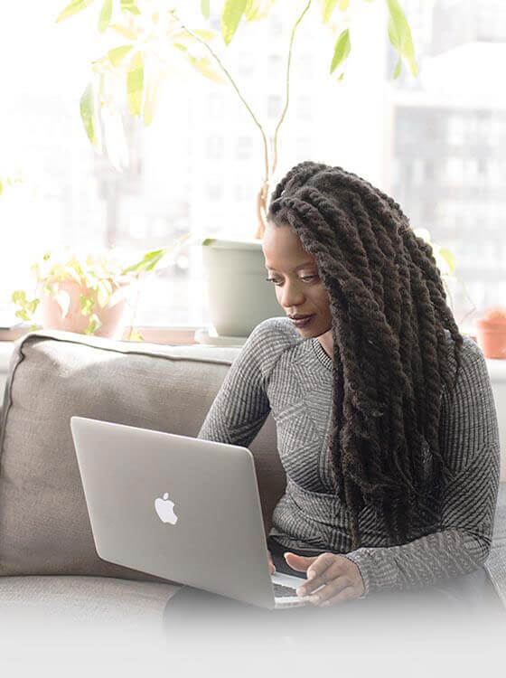 African American woman looking at a computer screen