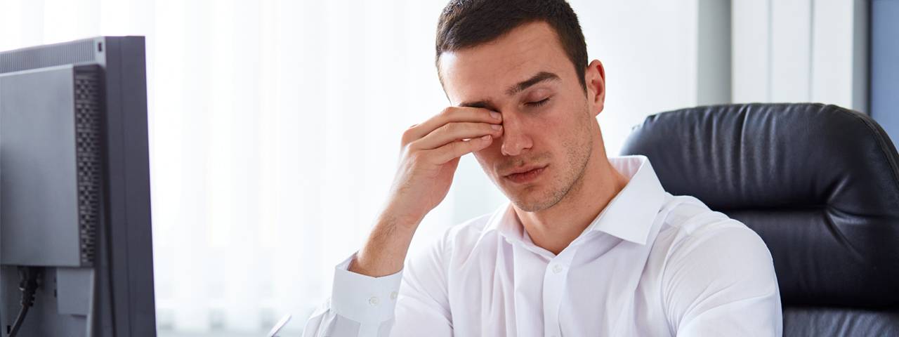 Man suffering from dry eye syndrome