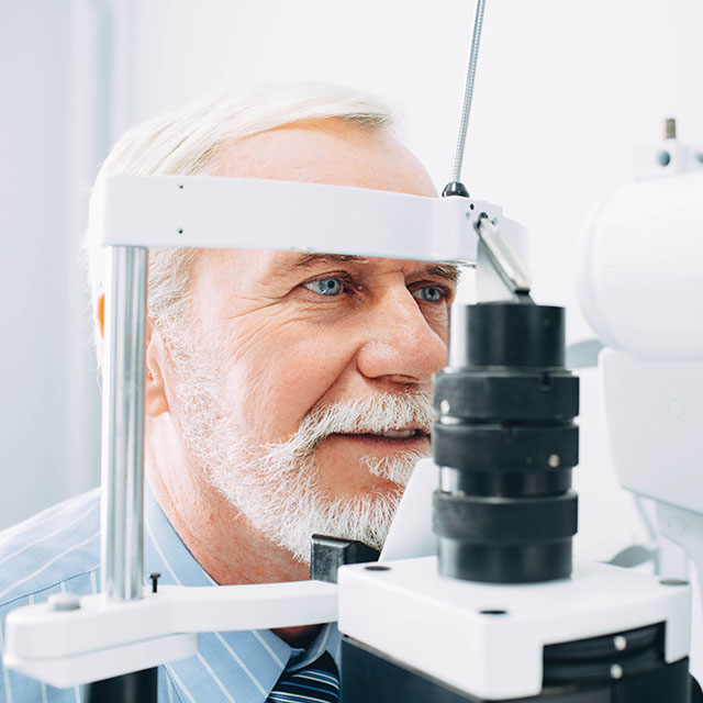 Senior Patient Receiving Eye Exam At Clinic, Eyesight Examinatio
