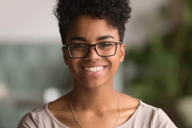 Headshot Portrait Of Happy Mixed Race African Girl Wearing Glass