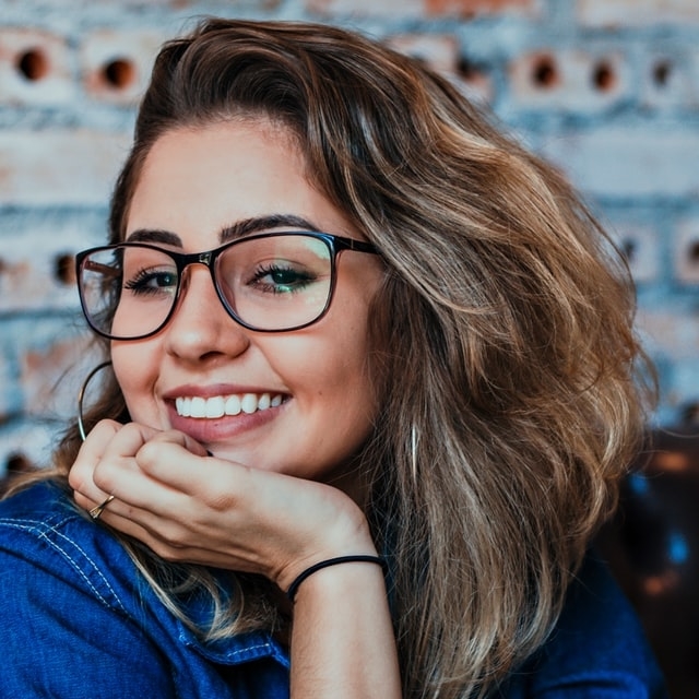 girl smiling with eyeglasses