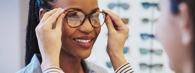 African Woman Trying on Glasses 1280x480 640x240