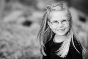 Young Girl Smiling Glasses