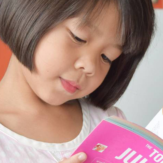 Asian Girl Reading Book