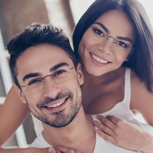 happy couple wearing invincilites eyeglasses 300x300