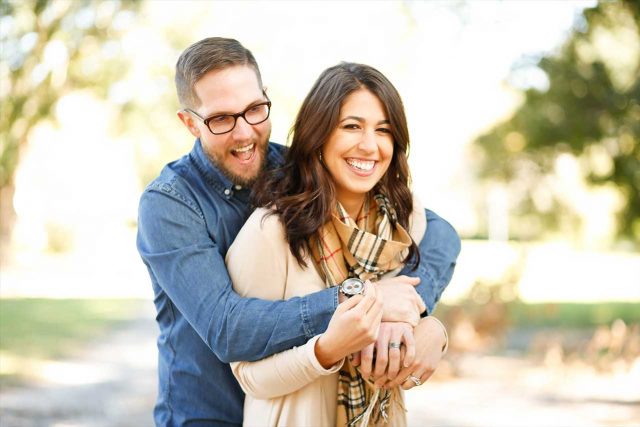 Woman wearing scleral lenses, with boyfriend in eyeglasses