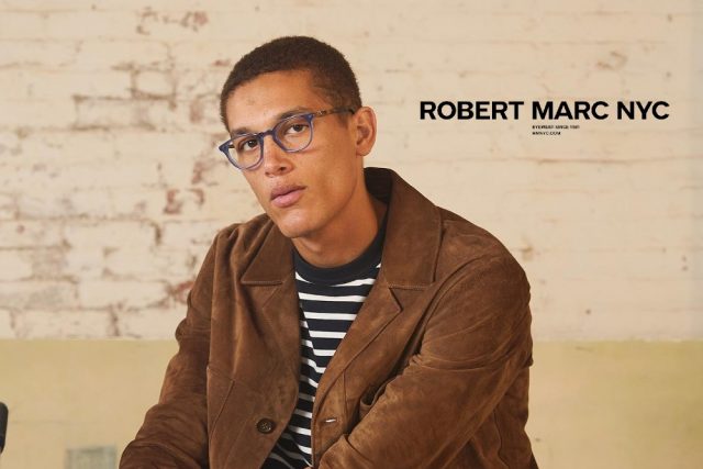 man wearing robert marc eyeglasses rbnyc logo