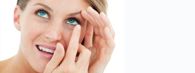 Eye doctor, woman putting on a contact lens in LaGrange, Carrollton, Oxmoor, & Springhurst, Kentucky