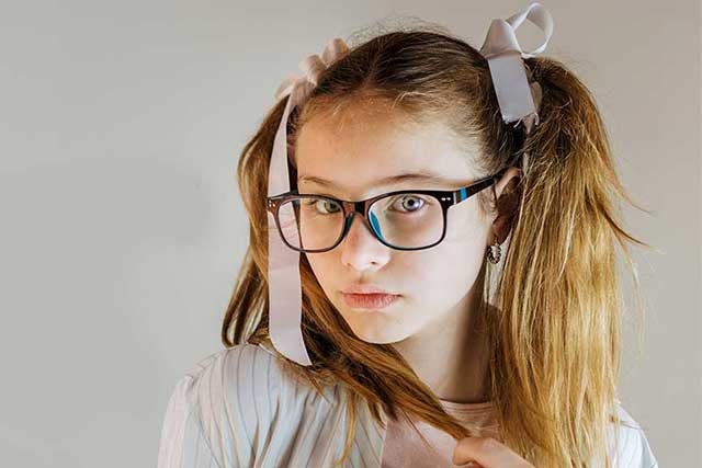 girl wearing glasses with myopia