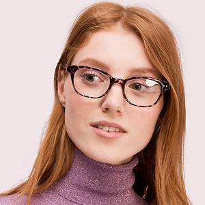 girl red haird wearing kate spade eyeglasses