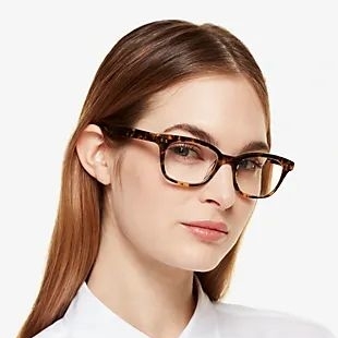 girl wearing brown rimmed kate spade eyeglasses