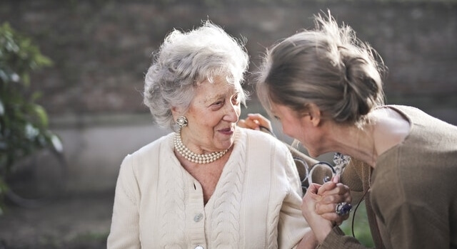 happy senior woman with her daughter 640px.jpg