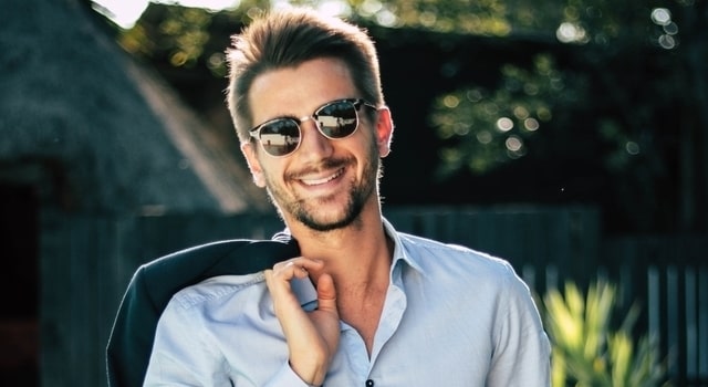man smiling wearing stylish sunglasses 640×350