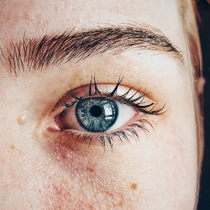 woman blue eye closeup