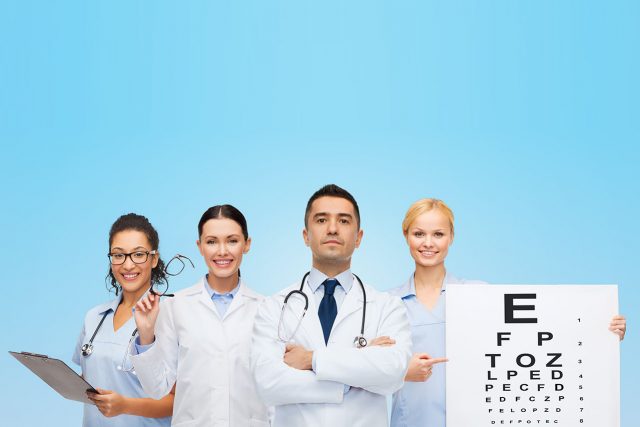 group of eye doctors with eye charts and glasses