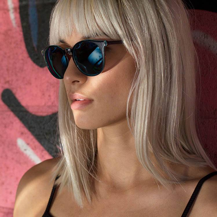 blonde hair girl wearing dragon sunglasses