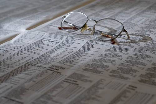 glasses on newspaper 500×335
