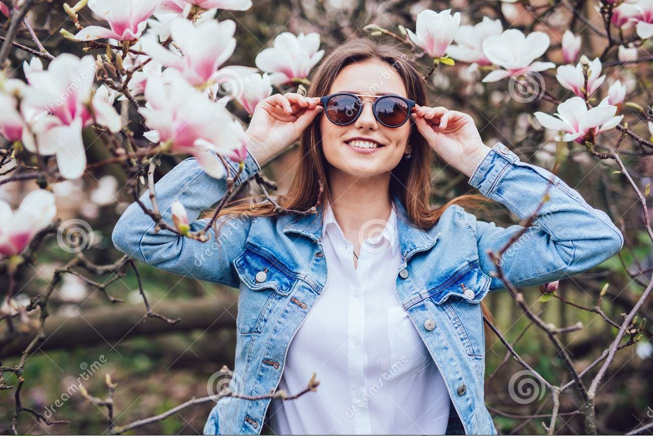 stylish woman sunglasses against blossom spring trees casual 2