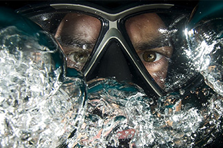 Eye doctor, man swimming with eye wear specialty in Billings, MT
