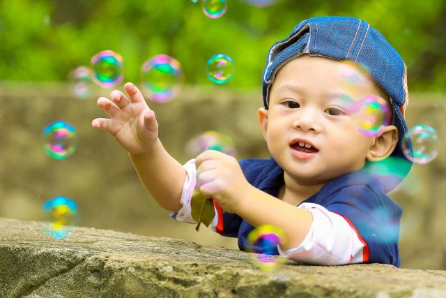 Baby Boy Playing with Bubbles 1280x853 1 640x427