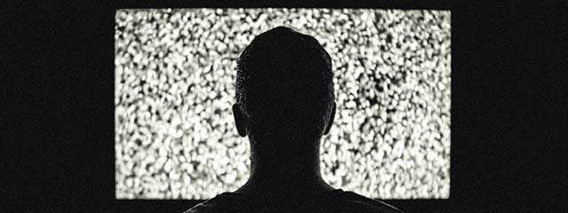 Person with Retinitis Pigmentosa watching TV