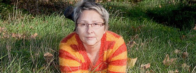 Older Woman Glasses Grass 1280x480 640x240