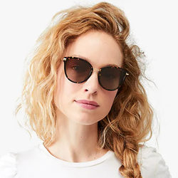 woman with kate spate sunglasses