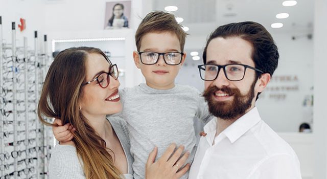 Family With Little Son In The Glasses Store