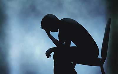 Silhouette of man in depression