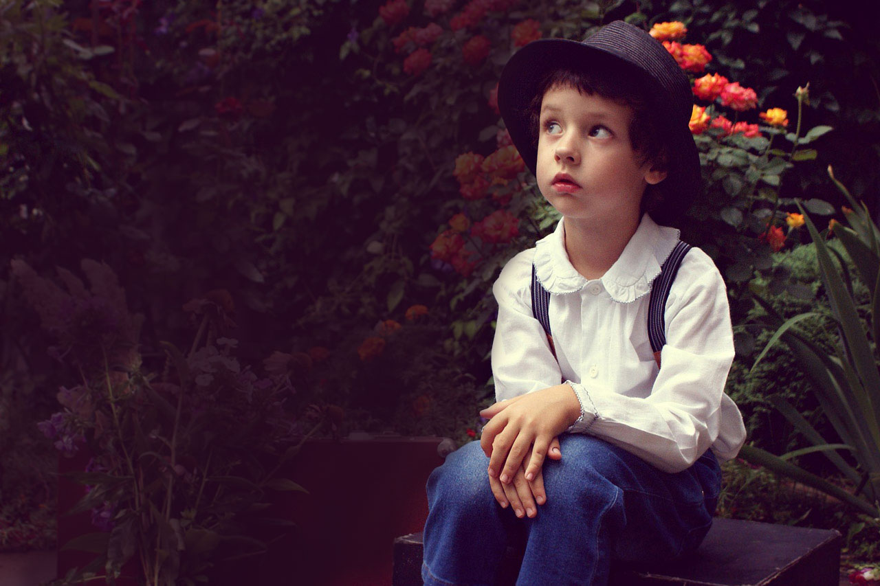 Boy Hat Sitting Garden