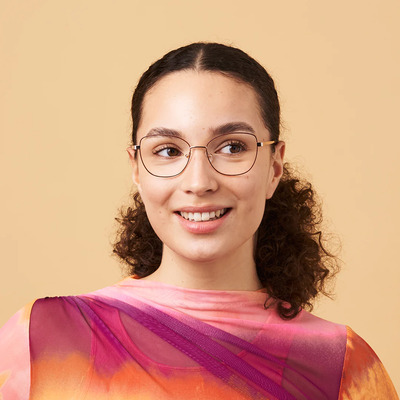 woman wearing rose gold eco eyeglasses