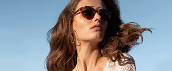 Woman wearing Cole Haan sunglasses