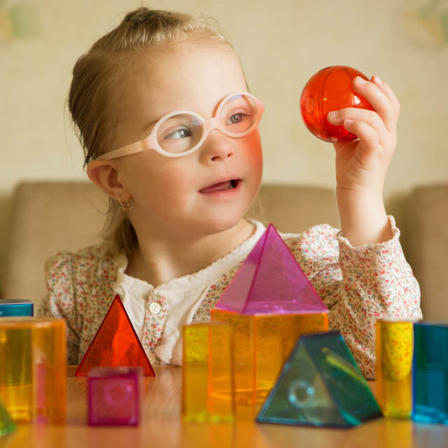 special needs downs syndrome girl with glasses