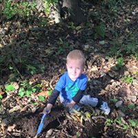 tree planting boy with spade