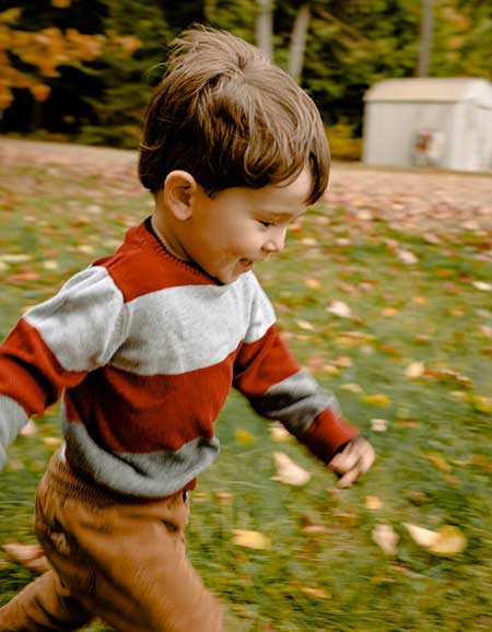 kid running in the garden