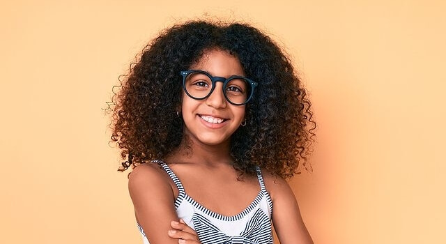 African american child with curly hair wearing casual clothes an