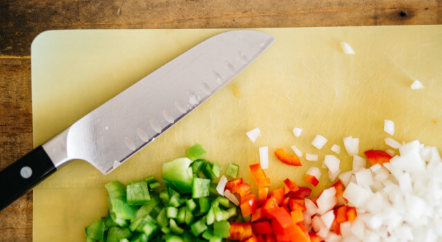 jenna cutting vegitables with Knife.640×350