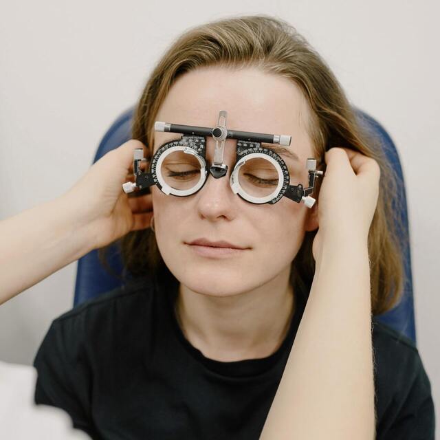 patient with glasses smiling