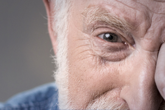 eye care, senior man with red eye in Saskatoon, SK