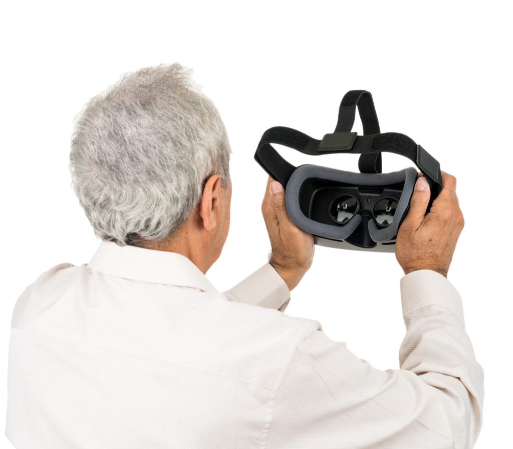 Older Man Looking at Inside of IrisVision