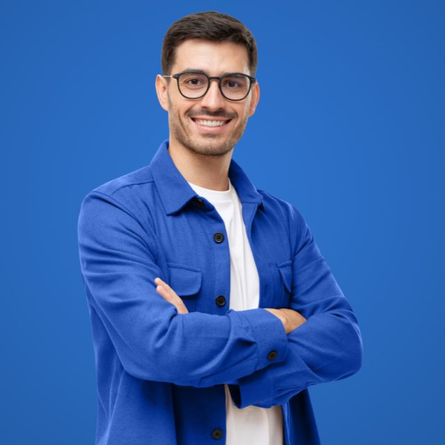 man wearing a blue shirt on a blue background