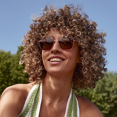 woman wearing rose gold eco sunglasses