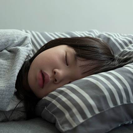 Asian Child Girl Sleeping On The Bed In Her Bedroom