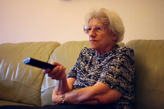 Woman Watching TV With Macular Degeneration