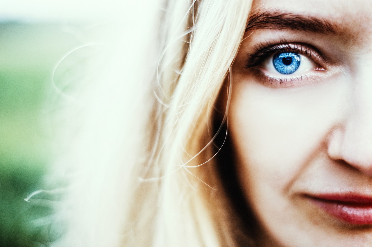 close up of woman with blue eyes, wearing scleral lenses