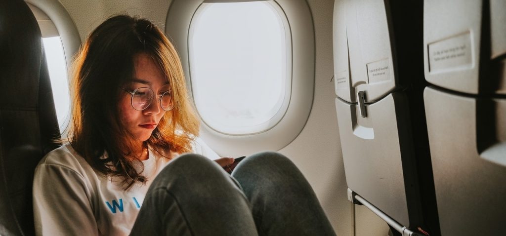 girl sitting in an airplaine