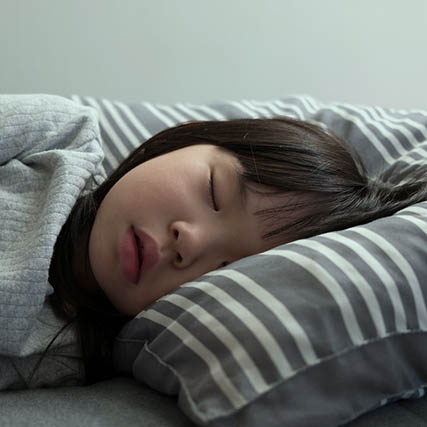 Asian Child Girl Sleeping On The Bed In Her Bedroom