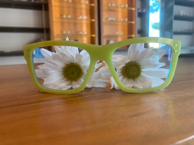 pair of green spexwax eyeglasses