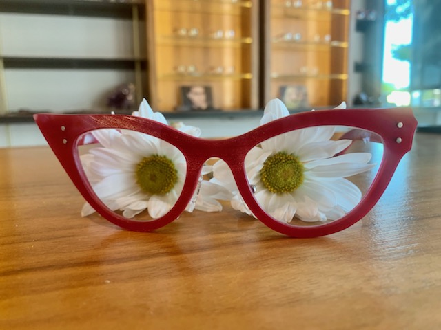 pair of red spexwax eyeglasses