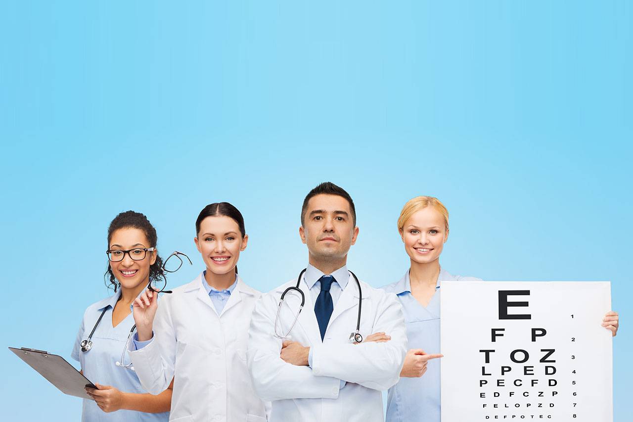 group of eye doctors with eye charts and glasses